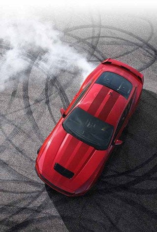 Overhead view of a 2024 Ford Mustang® model with tire tracks on pavement | Sarchione Ford of Randolph in Randolph OH