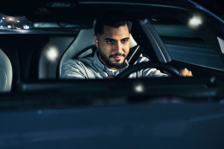 Person sitting in the driver’s seat of a parked 2024 Ford Mustang® coupe | Sarchione Ford of Randolph in Randolph OH